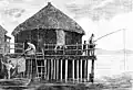 PSM V24 D321 A primitive stilt house in Switzerland on wood pilings.