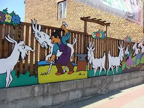 Koziołek Matołek on a road-side fence