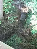 Panford Beck passing under the Elmham Road bridge at grid reference TF961215