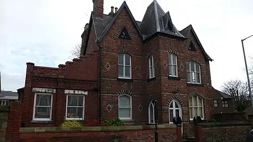 Park Lodge, an example of the neo-gothic style prevalent amongst houses along Rhosddu Road