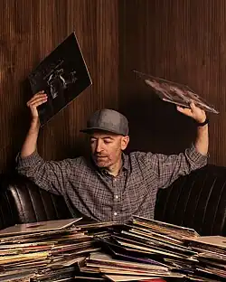 Peanut Butter Wolf at his vinyl bar Gold Line in Los Angeles, California, photo by Robb Klassen