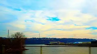 Image looking out over water from a bridge