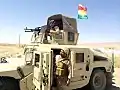 Peshmerga soldiers in a Humvee.