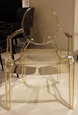 Louis Ghost, a simplified reinterpretation of armchairs in the Louis XVI style; by Philippe Starck; 2009; polycarbonate; height: 94&nbsp;cm; various locations[138]