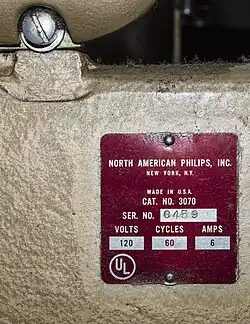 The manufacturer's data plate for one of the two DP70s in the Egyptian Theatre, Hollywood. It is attached to the pedestal, and therefore the "made in USA" statement is technically correct. The mechanism, however, was manufactured at the Philips factory in Eindhoven, The Netherlands.