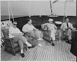 President Truman and members of his staff relaxing on the afterdeck of the yacht USS&nbsp;Williamsburg.