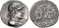 Silver coin of Plato Epiphanes wearing a crested Bactrian helmet adorned with bull's horn and ear.
