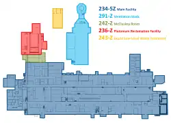 A color floor plan of five buildings of an industrial facility, each shaded a different color