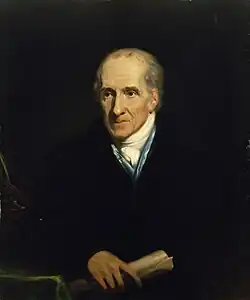 Portrait of an older Caucasian man on a black background.