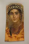 Portrait of a young woman in red; c.&nbsp;90–120&nbsp;; encaustic painting on limewood with gold leaf; height: 38&nbsp;cm (15&nbsp;in); Metropolitan Museum of Art (New York City)