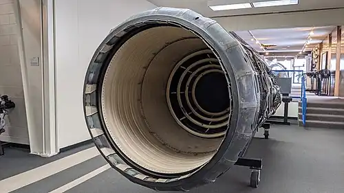 The afterburner was rated for continuous operation at 3,200&nbsp;°F (1,800&nbsp;°C) made possible with ceramic coatings (colored white) on duct liner and flame holders[85] and compressor bleed air cooling the duct and nozzle (above Mach 2.1 when the bleed was flowing). The nozzle is fully open, the maximum afterburning position. The main purpose of the variable nozzle area was to control engine operation which it did in conjunction with varying heat release in the afterburner.