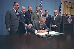 President Johnson signs a bill authorizing education programs for children with disabilities; from left to right: Hugh L. Carey, Dominick V. Daniels, Carl D. Perkins, Albert H. Quie, Winston L. Prouty, Cohen (1968)