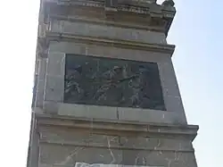 The relief on the war memorial at Proyart above the allegory of France greeting a soldier- Soldiers marching by.