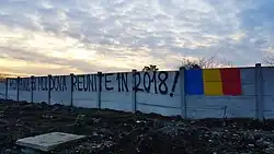 Graffiti in Bucharest. "Romania and Moldova reunited in 2018!".