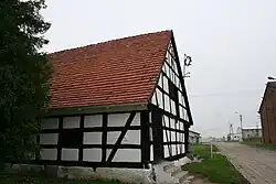 Historic timber framed granary in Raciniewo
