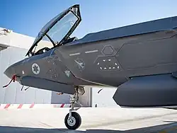 An F-35I Adir of 117 Squadron "First Jet" (see jet-in-the-crosshairs symbol) at the reopening in July 2021