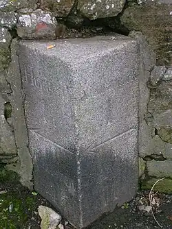 A milestone at the lazy corner near the parish kirk with directions to Kilmarnock, Hurlford, Galston and Ayr.[38][39]