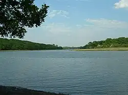 The River Hamble looking upstream towards Botley from Fosters Copse. Dock Copse can be seen on the left bank. Bloomfield Copse is on the right bank