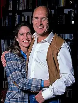 Picture of Robert Duvall and his then wife Gail Youngs in 1984, both are smiling and looking towards the camera. Duvall has his arm around Youngs and she has her arm around him