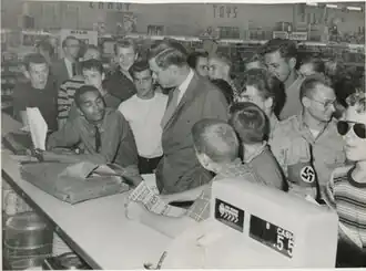 George Lincoln Rockwell, other Nazi Party members, and hecklers confront Dion Diamond at Cherrydale Drug Fair on June 10. Reprinted with permission of the DC Public Library, Star Collection © Washington Post