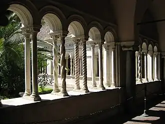 Cosmatesque style in action: twisted columns and mosaics at the cloister in San Giovanni in Laterano, Rome.