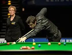 Ronnie O'Sullivan playing a shot