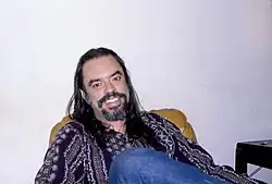 Root Boy Slim relaxing in his Takoma Park, Maryland home in 1980