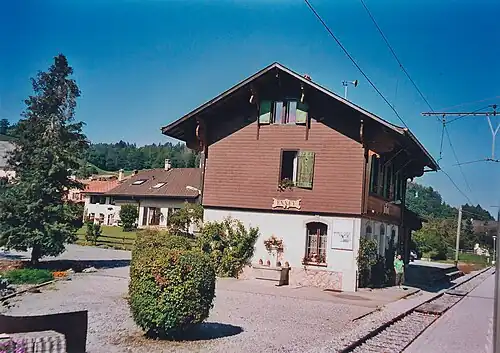 Three-story building next to a single-line track