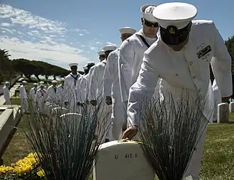 Sailors of USS Michael Monsoor pay respect to the grave of Michael Monsoor on 29 September 2016.