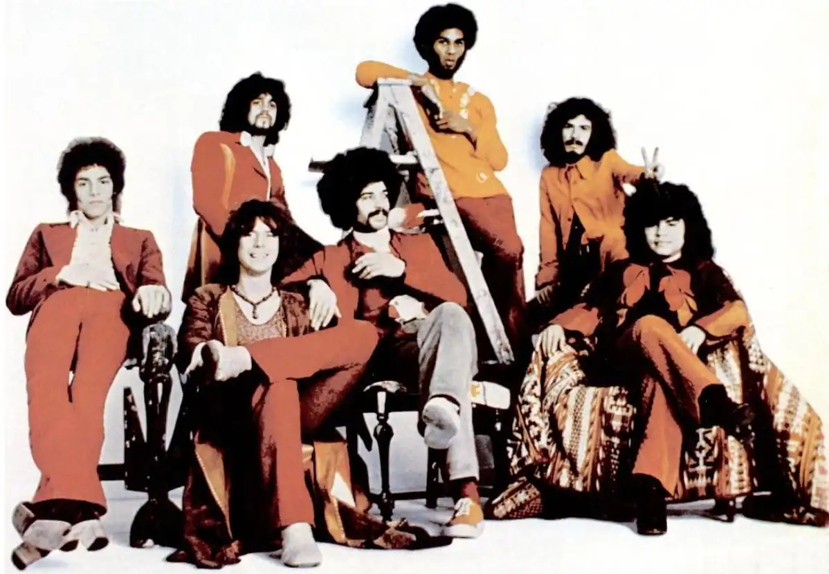 The "classic" line-up in 1971. Left to right: Neal Schon, Gregg Rolie, Michael Shrieve, Michael Carabello, David Brown, Carlos Santana and José "Chepito" Areas.
