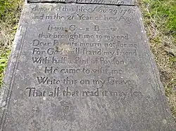 Photo of the grave of Sarah Smith showing the infamous accusation of murder.