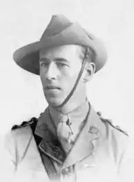 Head and shoulders of a young man in a shirt, tie, and slouch hat