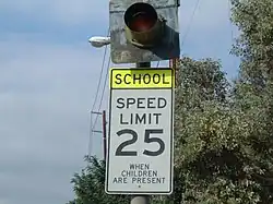 A school zone sign in the United States. When the light flashes, the set speed limit (in this case, 25&nbsp;mph (40&nbsp;km/h)) is active.