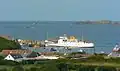 Scillonian III at the pier at St Mary's as seen from a distance