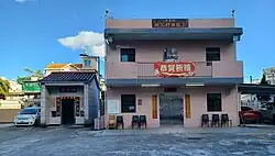 Entrance gate (left) of Sheung Yau Tin Tsuen and village office (right).