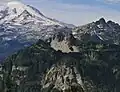 Mt. Rainier, Double Peak (centered), and the Cowlitz Chimneys (right) seen from Shriner Peak.