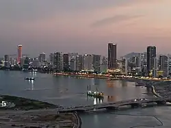 Aerial view of Gurney Drive, lined with skyscrapers, at dusk