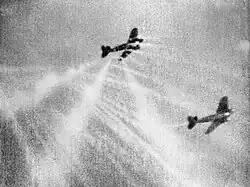 Gun camera photo of tracer ammunition fired from a Royal Air Force Supermarine Spitfire striking a Luftwaffe Heinkel He 111 during the Battle of Britain of World War II