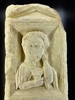 View of the niche with the figure and the upper part of the stele on the cast in the Musée de Lisieux.