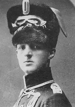 Busby, confused with Bearskin (this is not a British hussar 'busby' but a German kolpak)