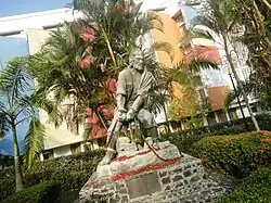 Outdoor statue of a man struggling against his chains