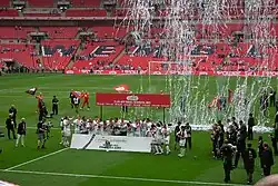Swansea City celebrating on the Wembley pitch