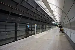 Picture of the Epping station entrance. It has two signs outside it: "M" for metro and "T" for trains.