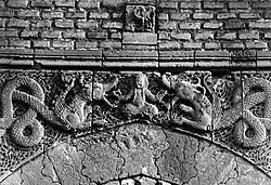 Figural scene carved on Bab al-Talsim, showing a figure wrestling two dragons