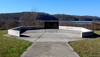 Concrete monument with view of reservoir in the background