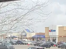 A row of stores at Tel-Twelve Mall, an outdoor shopping mall. Visible are storefronts for Lowe's and PetSmart.