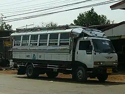 Medium-sized Hino Songthaew (truck bus) as seen in Sakon Nakhon, Thailand.