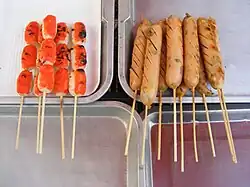 Grilled sausages on sticks for sale in Thailand