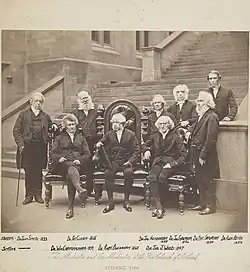 The Moderator and Ex Moderators of the Free Church of Scotland, Assembly; 1860. Pictured, from left to right, are (standing) Dr Smyth, Dr Clason, Dr Henderson, Dr Grierson, Dr N. Paterson and Dr Beith (behind); (seated) Dr Cunningham, Dr Buchanan and Dr Julius Wood.
