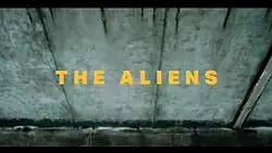 Series title against a concrete wall